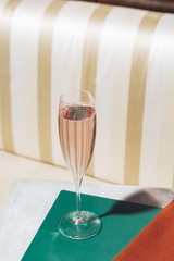 A cocktail with Prosecco, gin and flavoured tonic water on a table, in a elegant vintage pop...