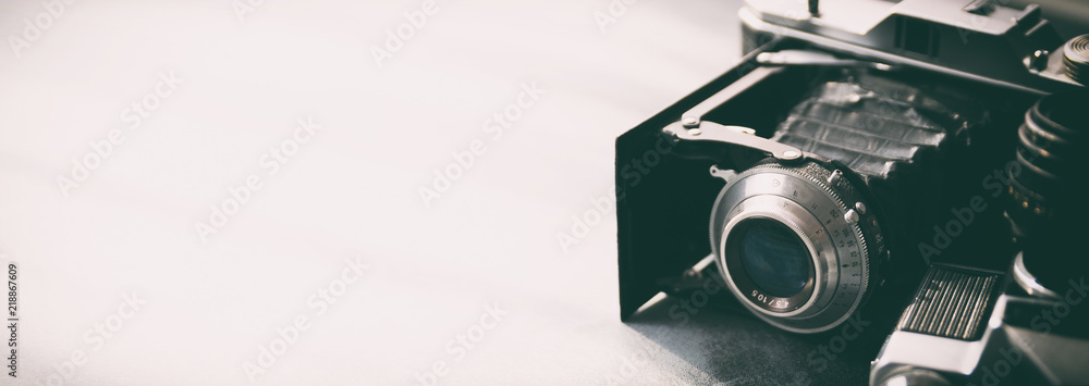 Wall mural retro cameras on gray table background