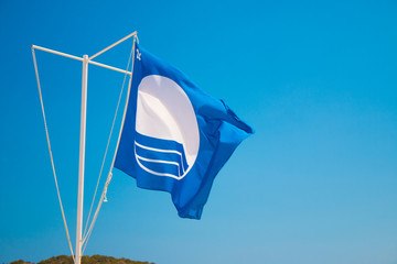 The flag for the best beaches in Europe. Greece, Crete 2018.  Blue Flag is an international award given to excellence, safety and cleanliness beaches