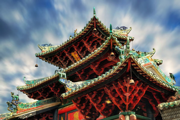 Fototapeta na wymiar Foshan Zumiao is a Daoist temple in Foshan, Guangdong, China. The temple was converted into Municipal Museum and listed as one of the main cultural relics. Typical Lingnan style roof details.