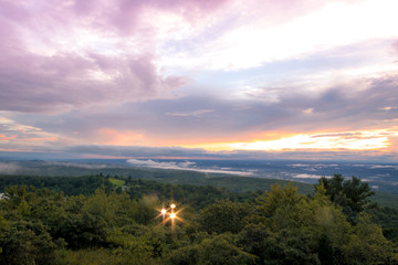 Fog lifts from the Kittany Mountains at sunset at High Point State Park, the top of NJ, in mid summer
