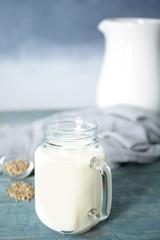 Mason jar with hemp milk on table