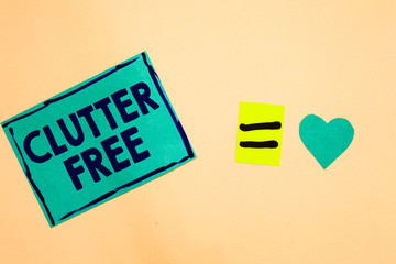 Text sign showing Clutter Free. Conceptual photo Well organized and arranged Tidy All things in right places Turquoise piece paper reminder equal sign heart sending romantic feelings.