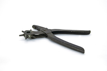 Equipment tool to pierce leather belt isolated in white background