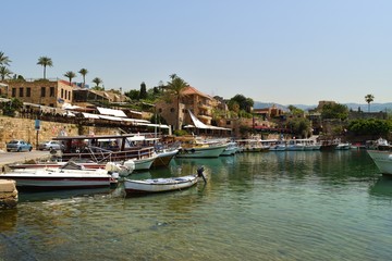 Fototapeta na wymiar Byblos Harbour with fishermen's boats and ancient houses