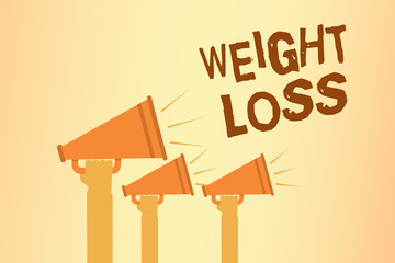 Writing note showing Weight Loss. Business photo showcasing Decrease in Body Fluid Muscle Mass Reduce Fat Dispose Tissue Hands holding megaphones loudspeakers important message speaking loud.