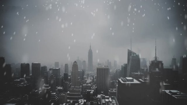 Snow falling in New York city on a cold grey day