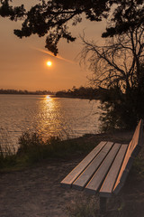 sunset in park. bench