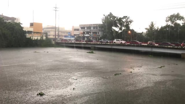 High definition video of overflowing water from a river because of heavy rain caused by monsoon rains and storm