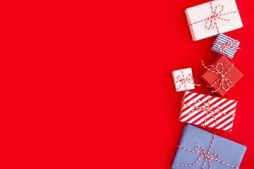 Gift boxes on a red background. Christmas, holiday backdrop.	