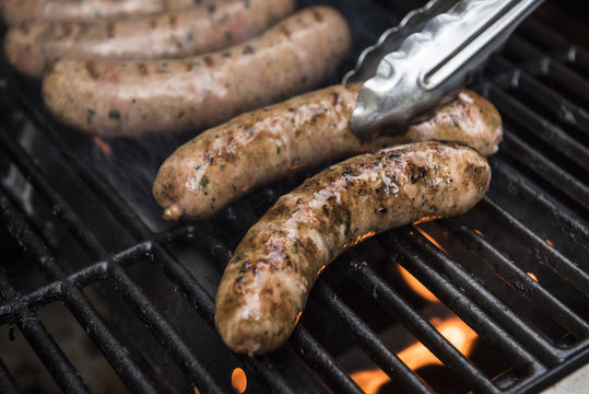 Sausages cooking on a grill