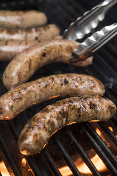 Sausages Cooking On A Grill