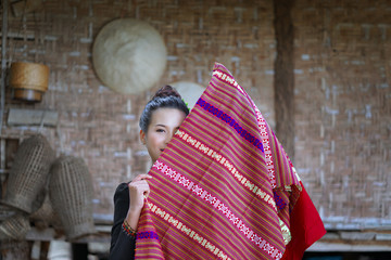 Portrait of beautiful Asian girl Wearing a Thai traditional dress.countryside South east asia,                                                                                  