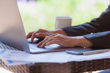 Young Business woman using modern laptop hand.