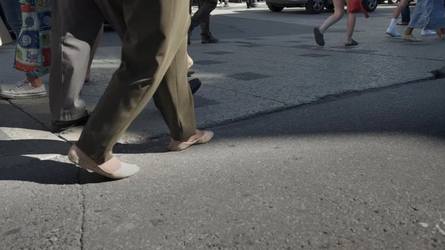 Slow Motion of City Foot Traffic, Anonymous Crowd, People Walking, Crossing at Intersection of Streets in Front of Car. Sunny Summer Day. Busy City Background.