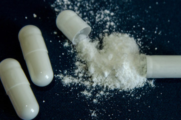 tablets are scattered on the table, dosage for the patient