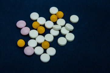 tablets are scattered on the table, dosage for the patient
