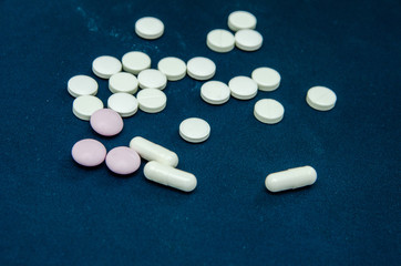 tablets are scattered on the table, dosage for the patient