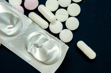 tablets are scattered on the table, dosage for the patient
