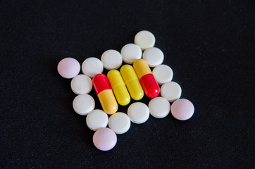 tablets are scattered on the table, dosage for the patient