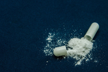 tablets are scattered on the table, dosage for the patient