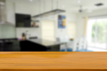 wood table top and blur kitchen room