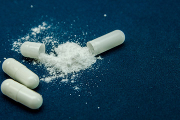 tablets are scattered on the table, dosage for the patient