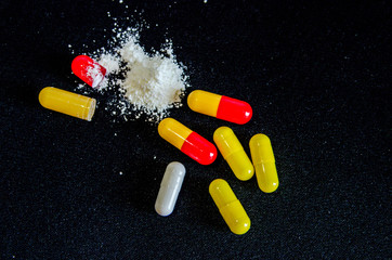 tablets are scattered on the table, dosage for the patient