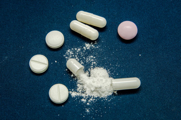 tablets are scattered on the table, dosage for the patient