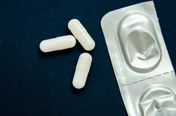 tablets are scattered on the table, dosage for the patient