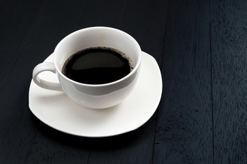 Cup of coffee on a wooden table