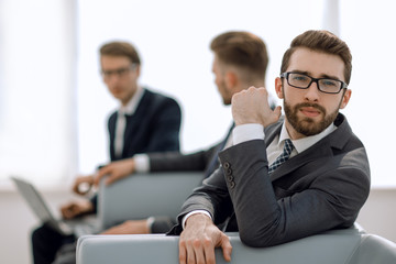 modern businessman sitting in a business center