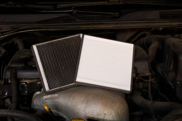 New and old car air filter. Close up.