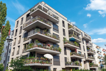 Modern grey apartment building with big balconies seen in Berlin, Germany