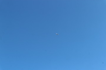 The plane in the deep blue sky