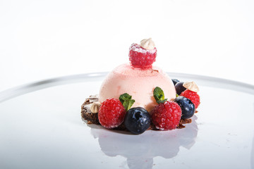 delicious pink dessert covered with fresh raspberry and blueberry