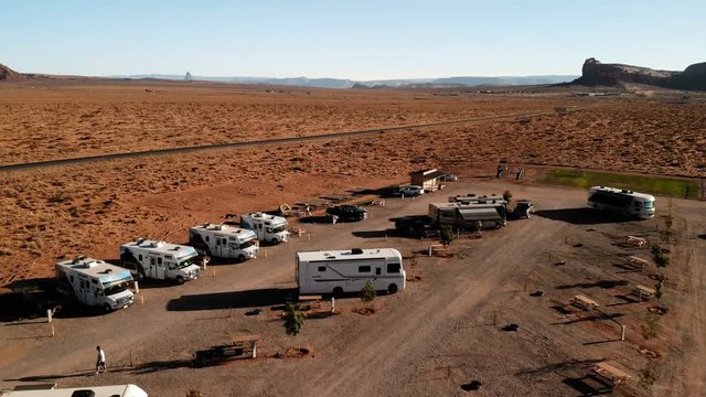 RV park (campground) near the Oljato–Monument Valley, Utah. Aerial view, from above, drone shooting. Arizona - Utah border. Sunset
