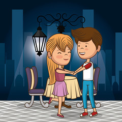 bridal couple having dinner on the street at night