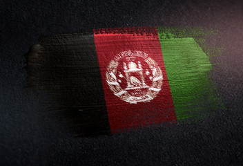 Afghanistan Flag Made of Metallic Brush Paint on Grunge Dark Wall