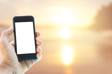 phone in hand and sea sunrise