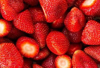 cut strawberries close up background