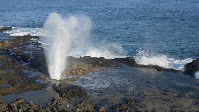Slow motion (59.94 fps rendered at 29.97) view of the Spouting Horn blowhole in the Koloa District of southern Kauai, Hawaii.