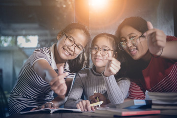 cheerful asian teenager student relaxing in home living room