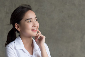 smart thoughtful woman thinking, planning; portrait of asian woman looking up, thinking, finding good idea or decisive plan; 20s young adult asian chinese thai woman model