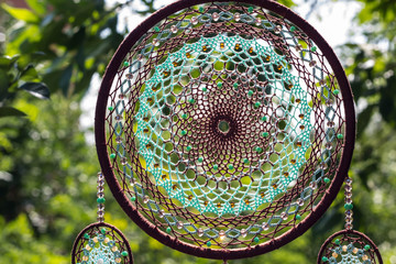 Handmade dream catcher with feathers threads and beads rope hanging