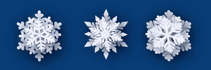 Vector set of 3 white Christmas paper cut 3d snowflakes with shadow on dark blue background. New year and Christmas design elements