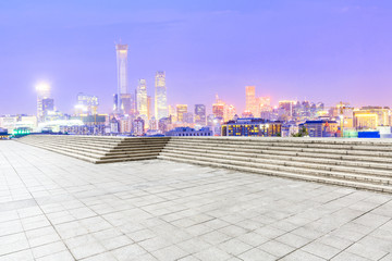 Obraz premium Empty square floor and modern city skyline in Beijing at night