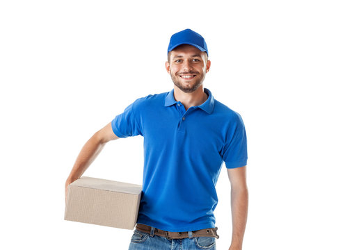 Happy Young Delivery Man In Blue Uniform Standing With Parcel Post Box