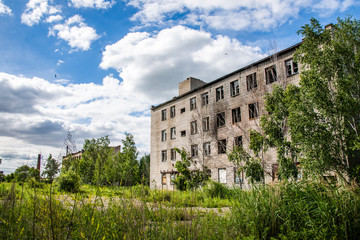 Fototapeta na wymiar Old, destroyed, abandoned houses and buildings, broken Windows and doors