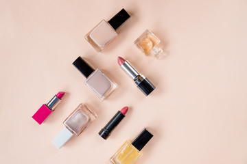 Fototapeta na wymiar Creative flat lay of fashion bright nail polishes and decorative cosmetic on a colorful background. Minimal style. Copy space. Beauty blogger concept. professional makeup.Top view.Copy space